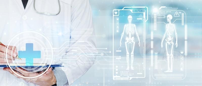 Medical professional with digital tablet viewing holographic skeletal scans and health data on blue interface.
