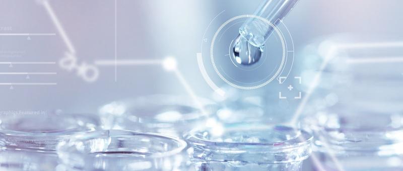 Laboratory pipette dropping liquid into petri dish with digital targeting interface in soft blue tones.