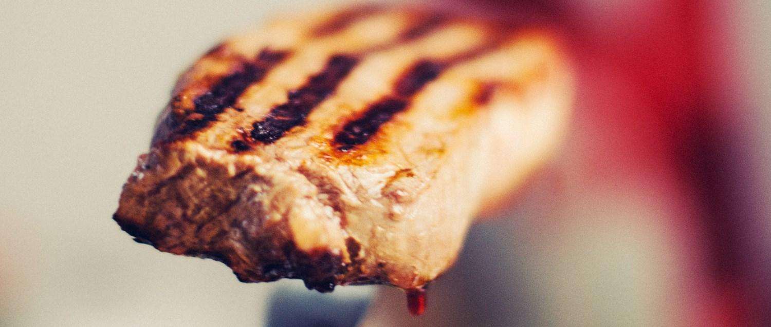 Steak red meat on a fork